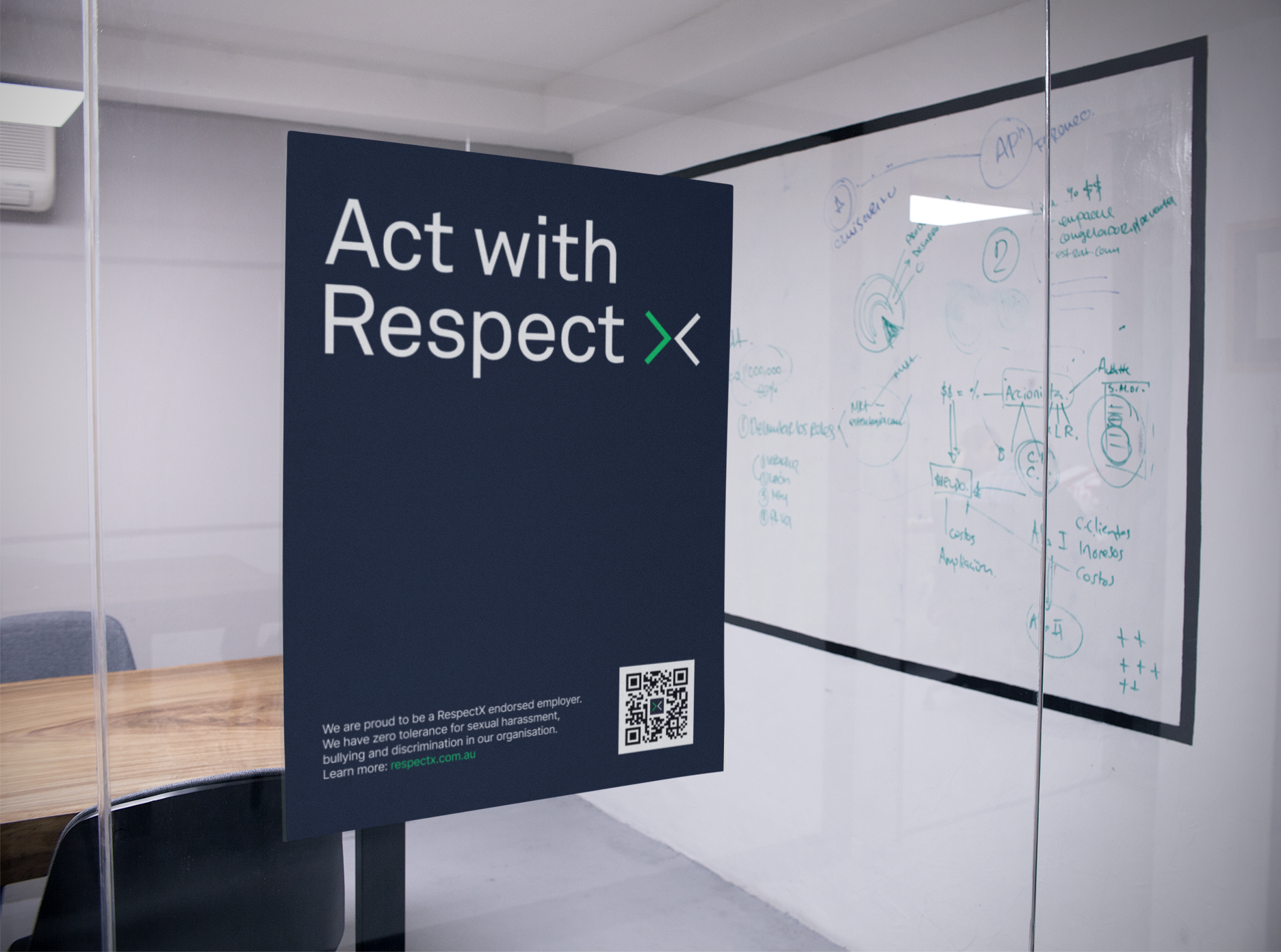 A respect poster stuck to the glass wall of an office meeting room